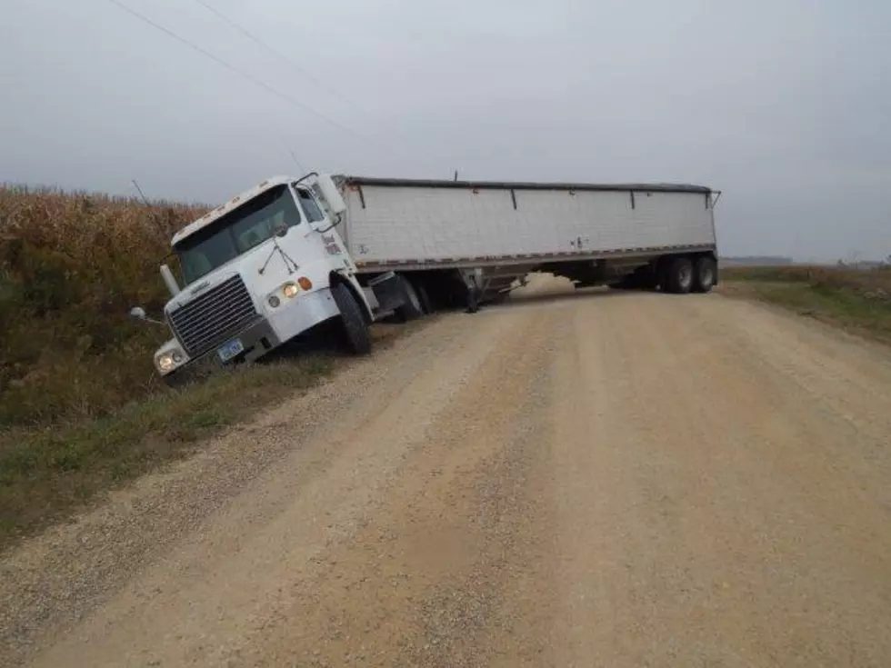 Road Gives out to Semi Loaded with Beans
