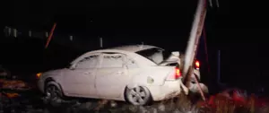 Car Slides Off Road and Collides with Utility Pole