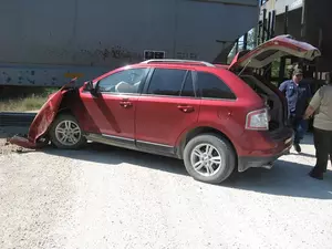 Car Nearly Crushed by Train, Driver OK