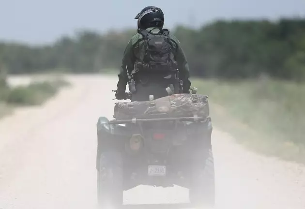 Man Rolls ATV While Pulling a Trailer with a Mower