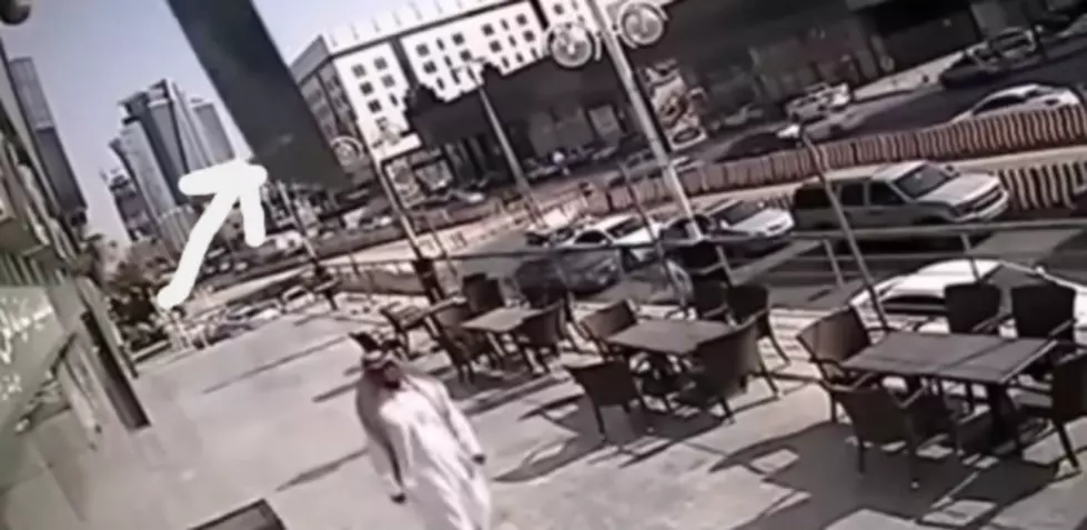 Glass Nearly Impales a Guy Walking Down the Street [VIDEO]