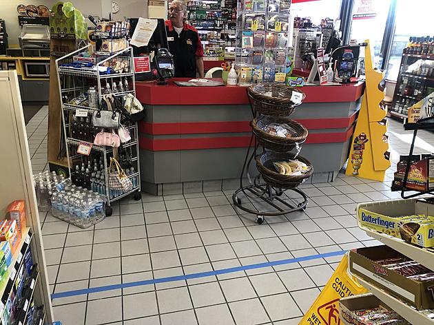 Cedar Rapids Gas Station Asks Customers to Stay Behind Blue Line