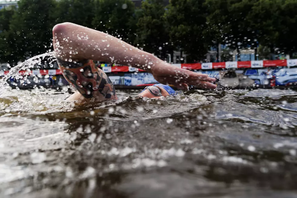 Triathlete Swims Laps in Flood Waters