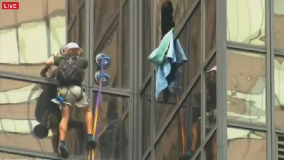 Person Scales the Outside of Trump Tower in New York