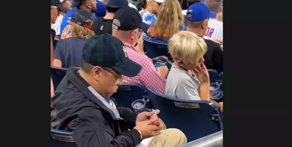 Internet Goes Wild for Yankee Fan That Used Hot Dog as a Beer Straw