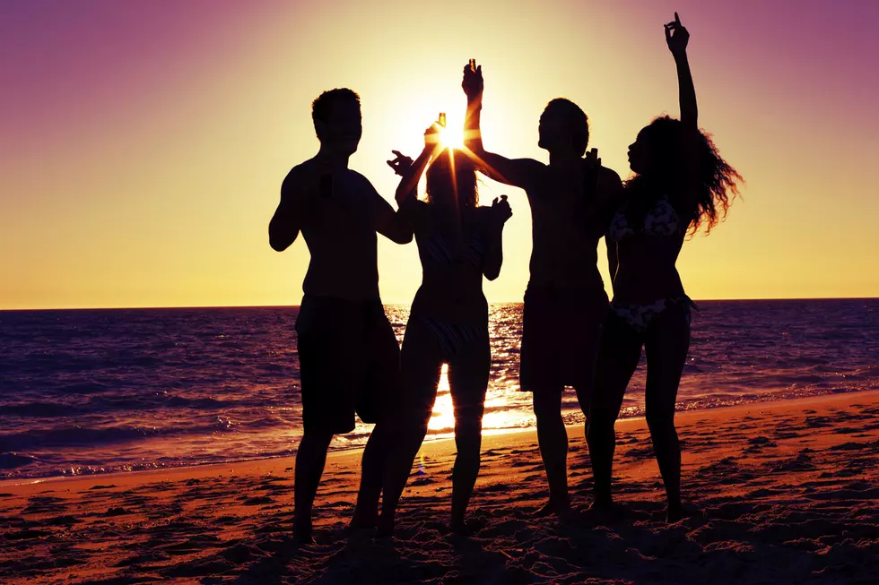 People having party at beach with drinks