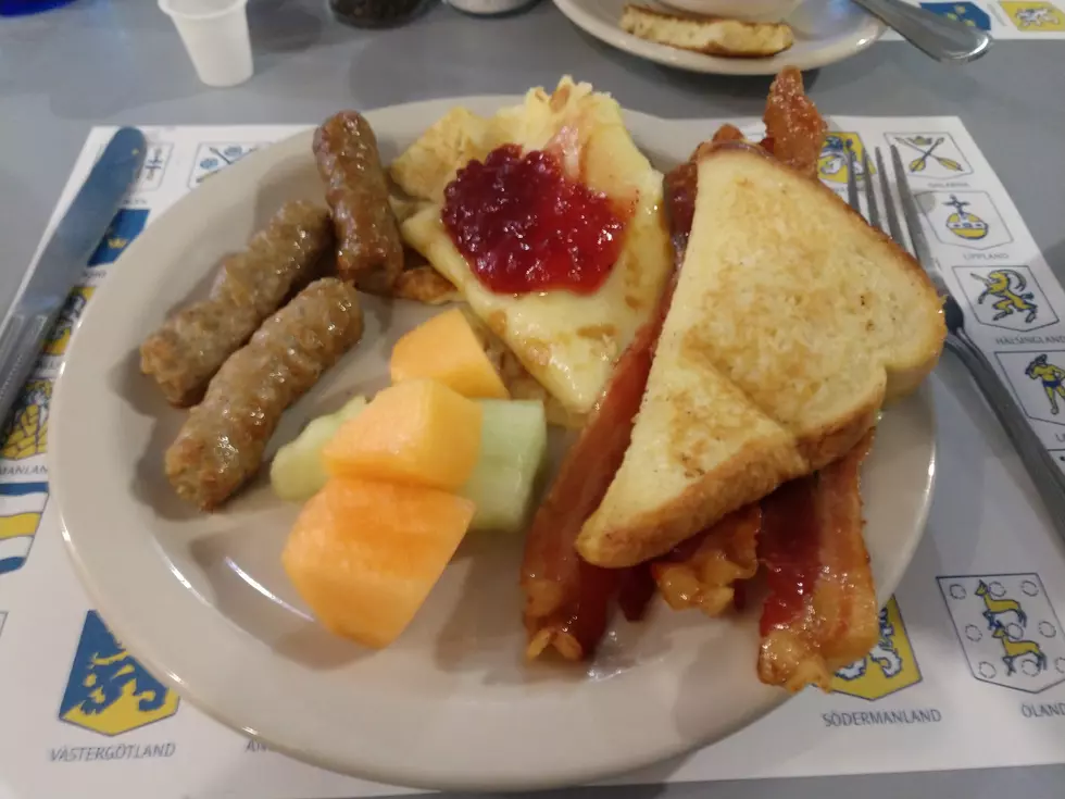 My (second) plate of food. The Swedish pancakes topped with lingonberry jam are at the center-top of the plate. Photo Credit: Steve Pulaski