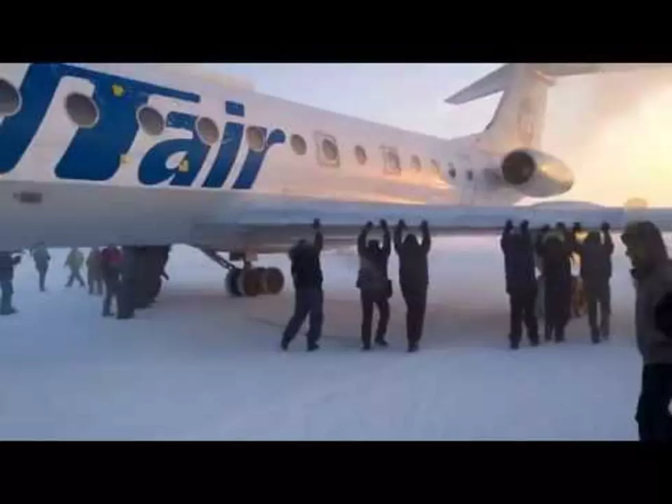 A Plane Got Frozen to a Runway, and Passengers Had to Get Out and Push It [VIDEO]