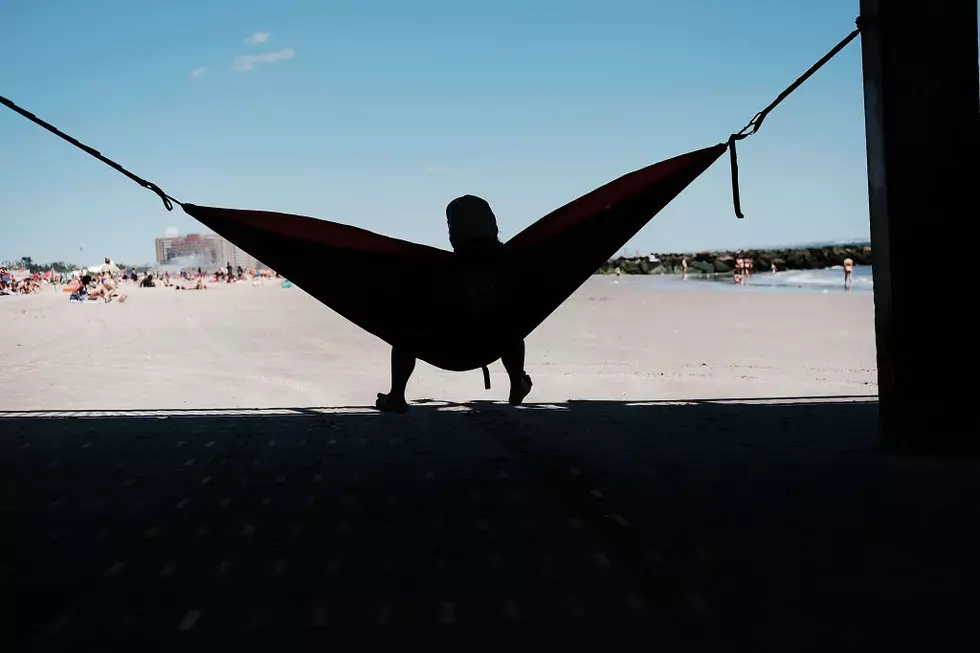 Man Sets Up and Relaxes in a Hammock at MSP Airport