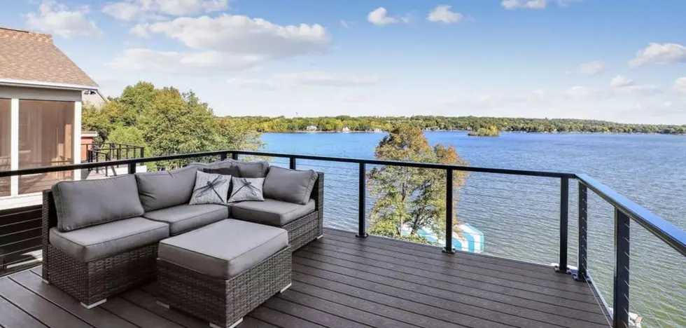 This $2.45M Prior Lake Home Features A Boathouse W/ A Deck