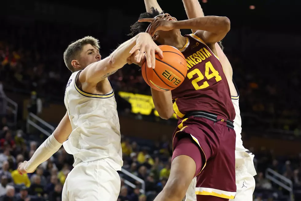 Dickinson Scores 28, Michigan Holds Off Minnesota 60-56