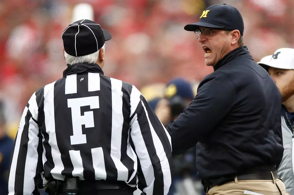 Why is Jim Harbaugh in Trouble?