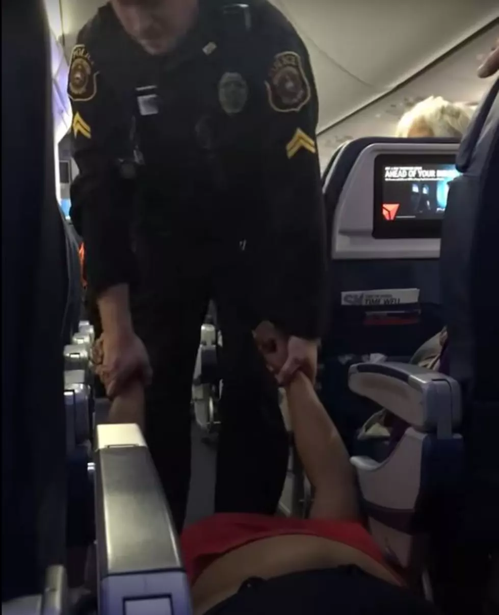 Video of Woman Dragged of Delta Jet in Detroit for Boarding Early