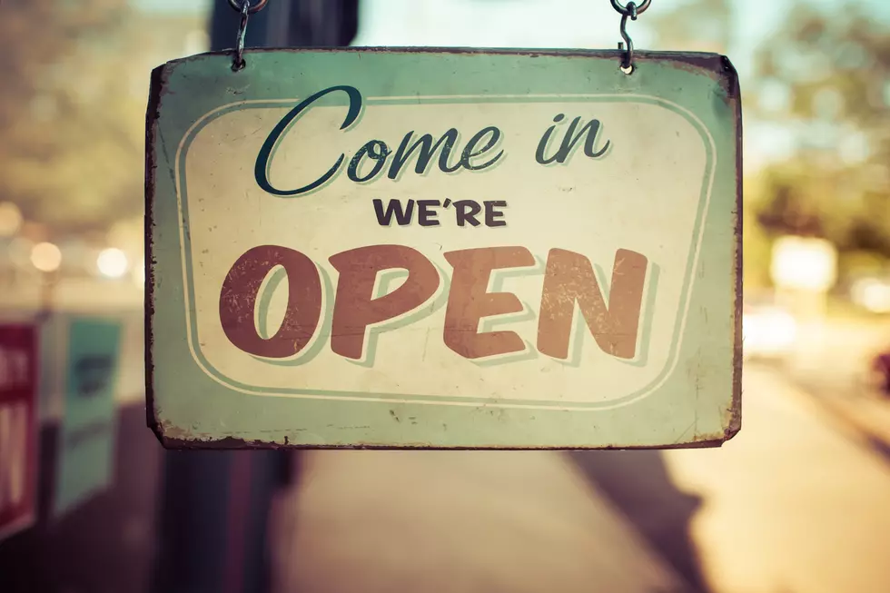 Vintage processing of an open for business sign in small town America.