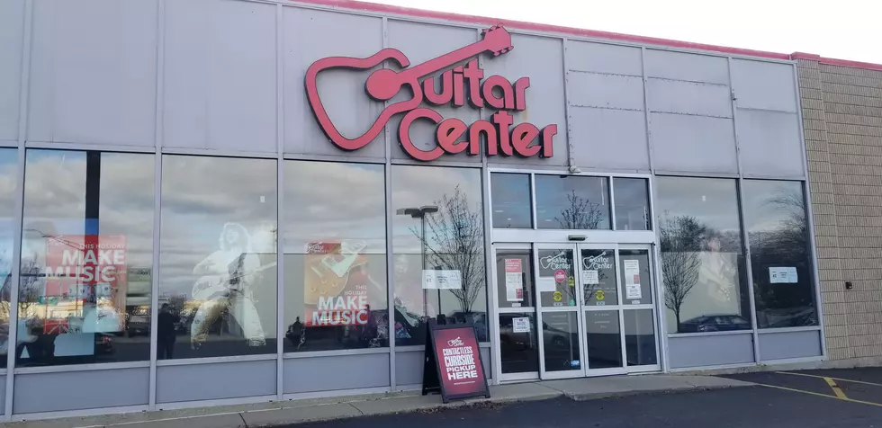 Name these Rockers in the Windows of Guitar Center Kalamazoo