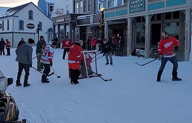 Mackinac Island Residents Play A Game of Winter Pickup Hockey Downtown
