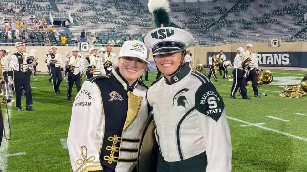 Twins In MSU/Western Marching Bands Meet On Field After Game