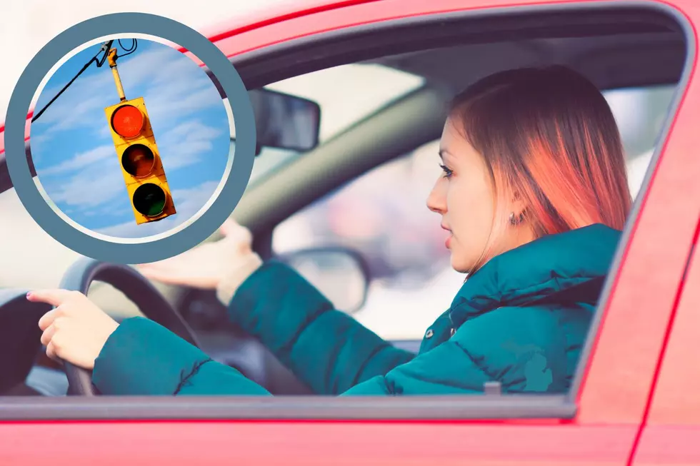 A woman sits impatiently at a Michigan stoplight