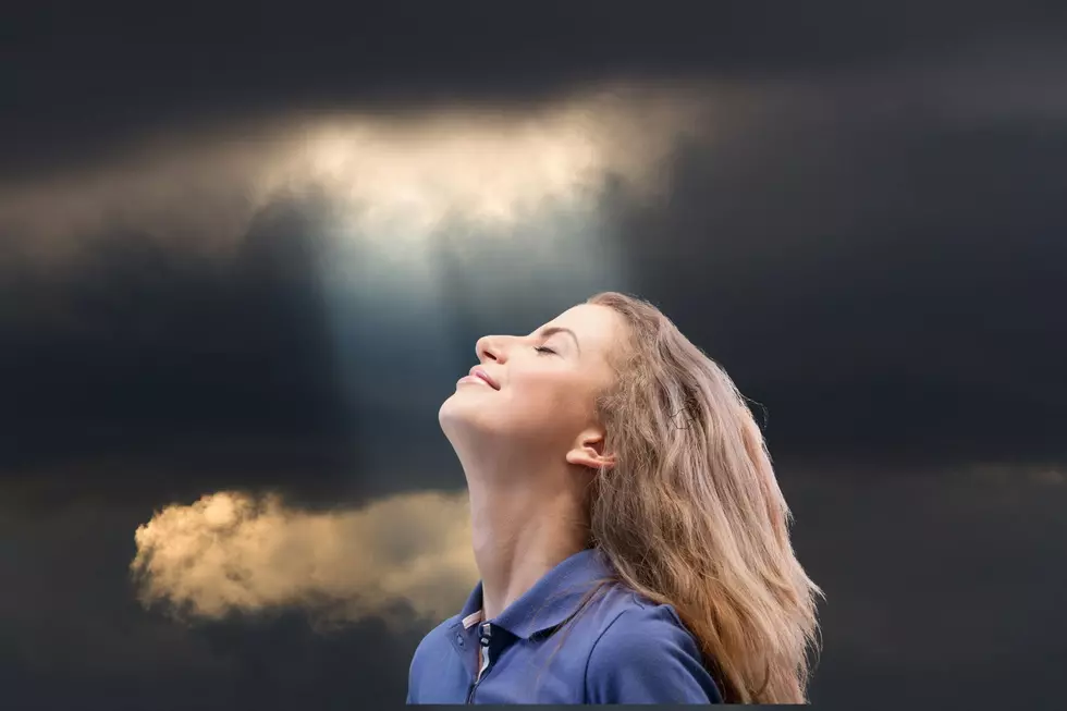 A single ray of light is soaked in by a person