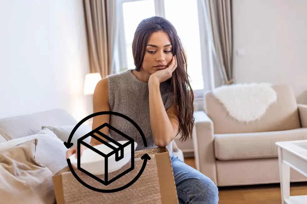 A woman looks at a gift in frustration, showing her dissatisfaction
