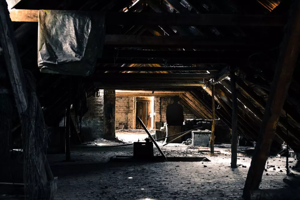A seemingly innocent attic at first glance shows a shadow figure hiding in the distance.