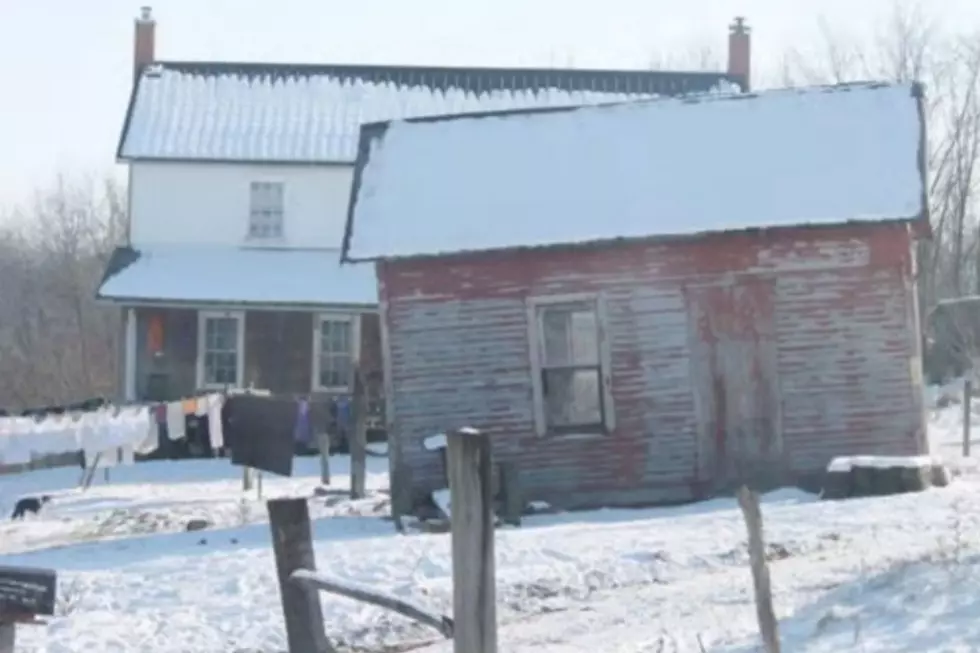 A chilly winter scene with snow covered ground outside of an Amish home, similar to many seen in Michigan.