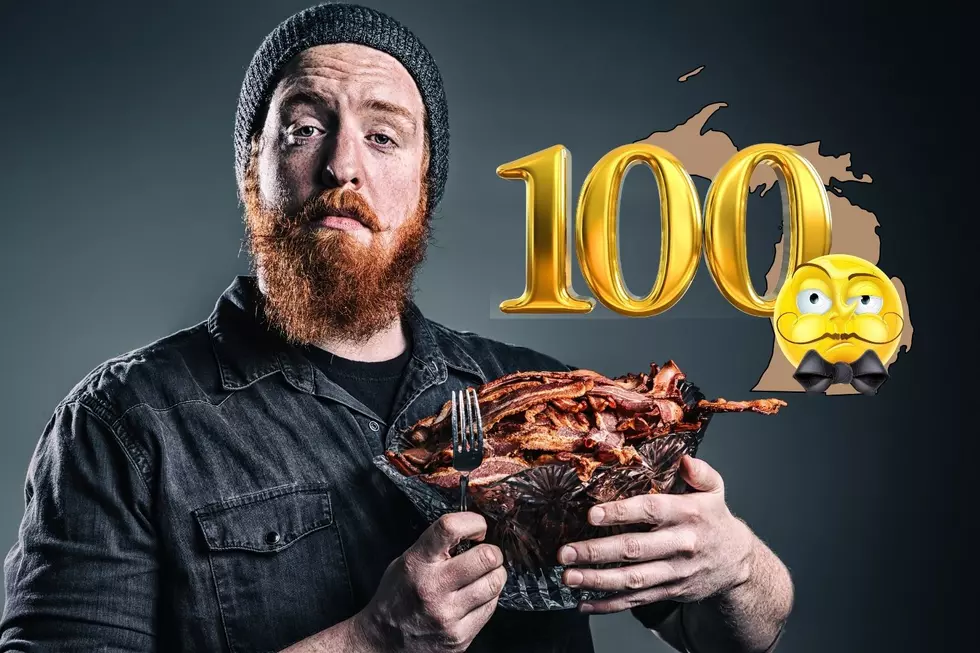 A man stands with a crystal bowl full of meat, showing that snobbery in Michigan isn't just tied to income. An outline of Michigan is also seen with a 100 graphic and a snobby cartoon face wearing a bowtie.