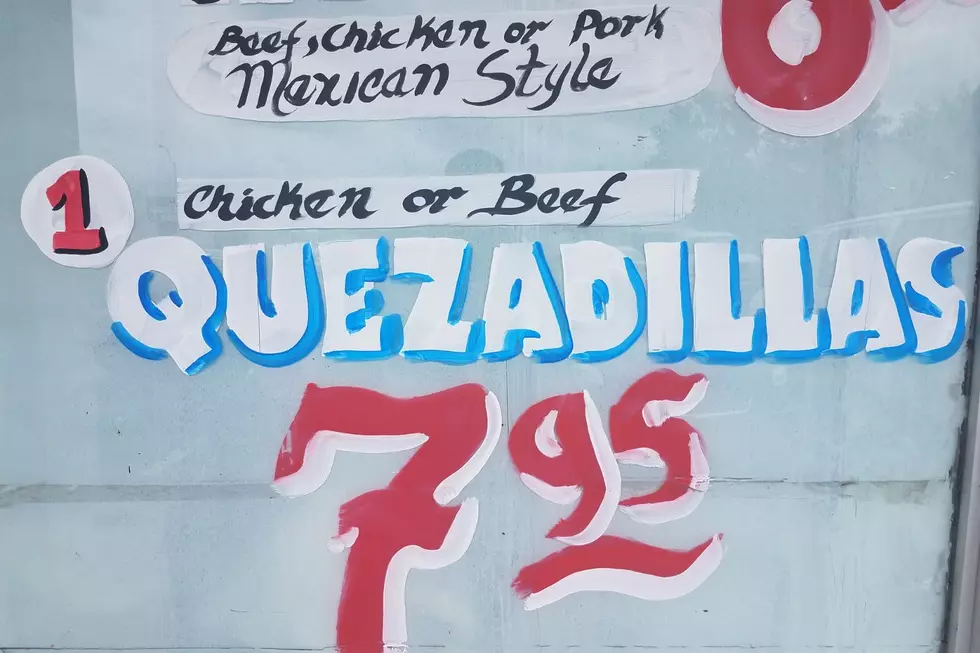 A menu board featuring ‘QUEZADILLAS’ is seen