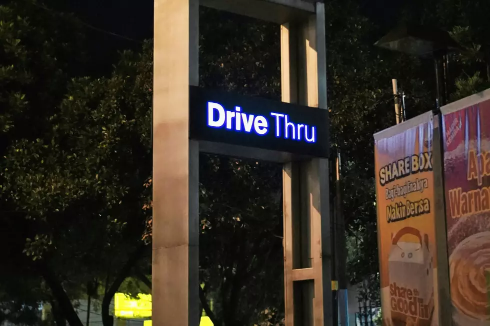 A DRIVE-THUR sign on a fast-food restaurant.