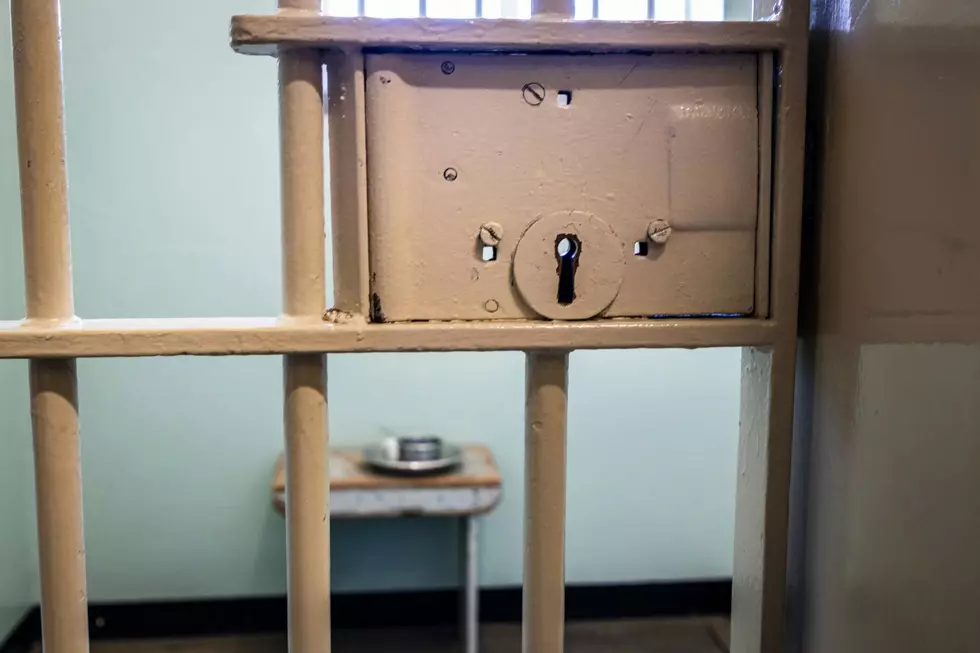 The outside of a jail cell looking in.