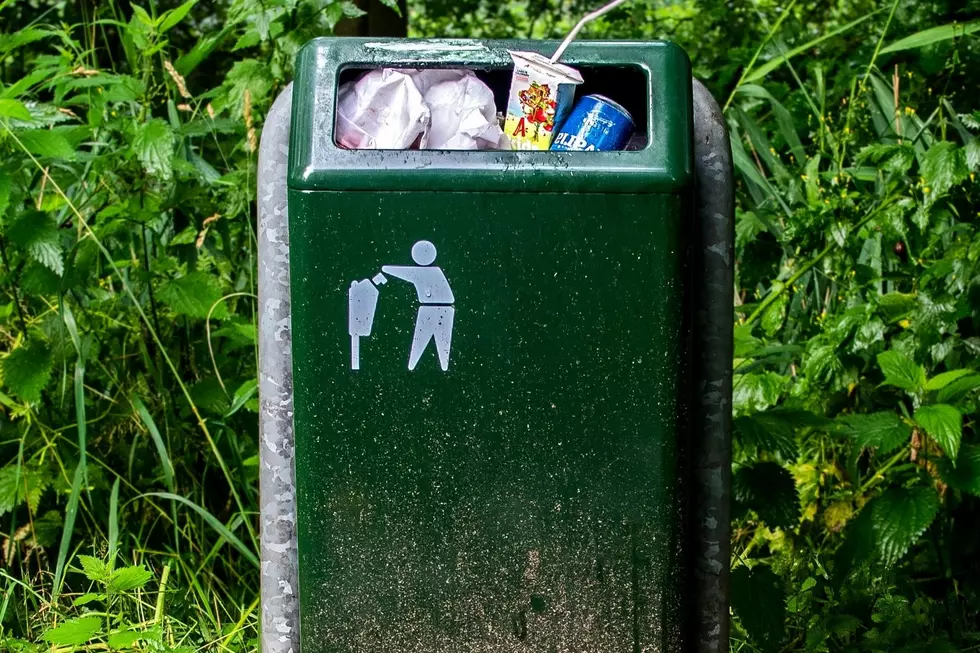 A filthy, overflowing trash container.