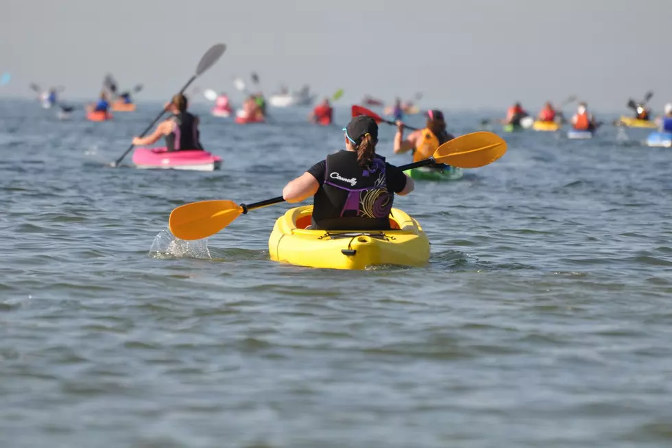 Kayakers as far as the eye can see on Michigan's Great Lakes Way bluewater trail.