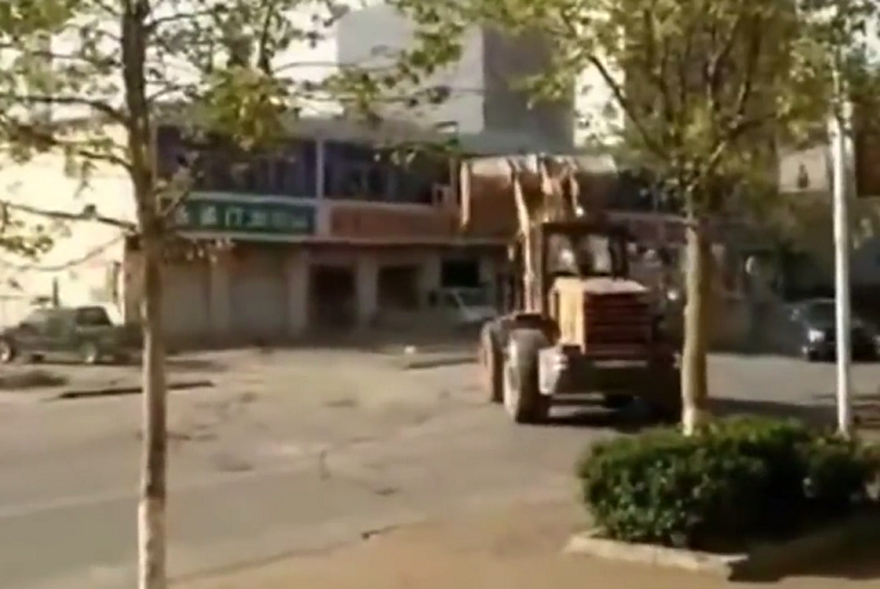 Transformer-Style Bulldozer Battle Between Construction Workers
