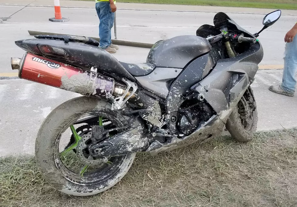 Motorcycle Through Wet Concrete on I-69 in Bath Township