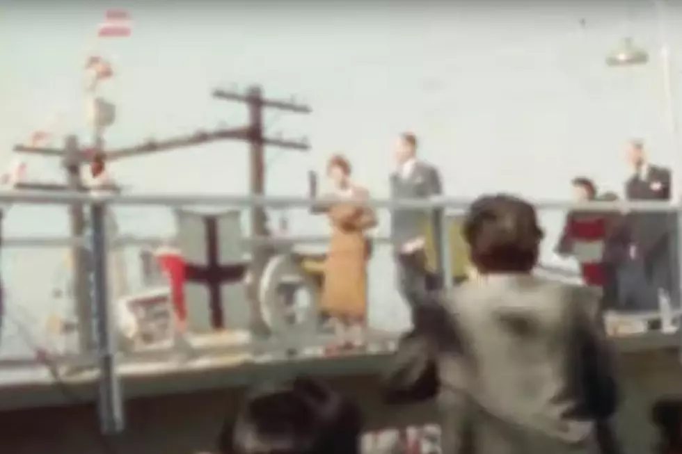 Queen Elizabeth II waves as she and Prince Philip disembark the Royal Yacht Brittania in 1959. Photo via YouTube (madmickshere)