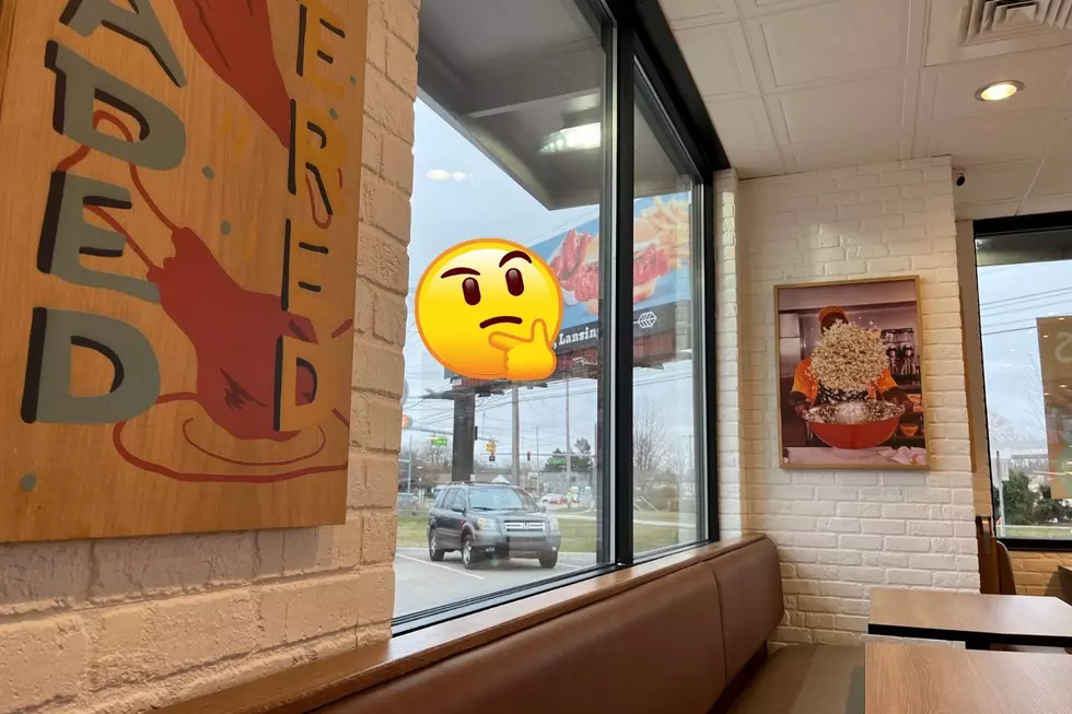 Is There a Fast Food Billboard Battle Happening in Lansing?