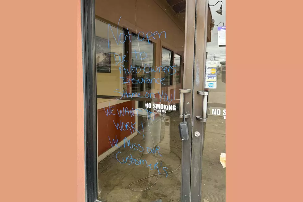Flap Jack in Lansing near Frandor is still not open after fire, windows suggest owners and workers cannot return because insurance money isn't being paid out in a timely fashion - Flapjack windows with writing on them 7