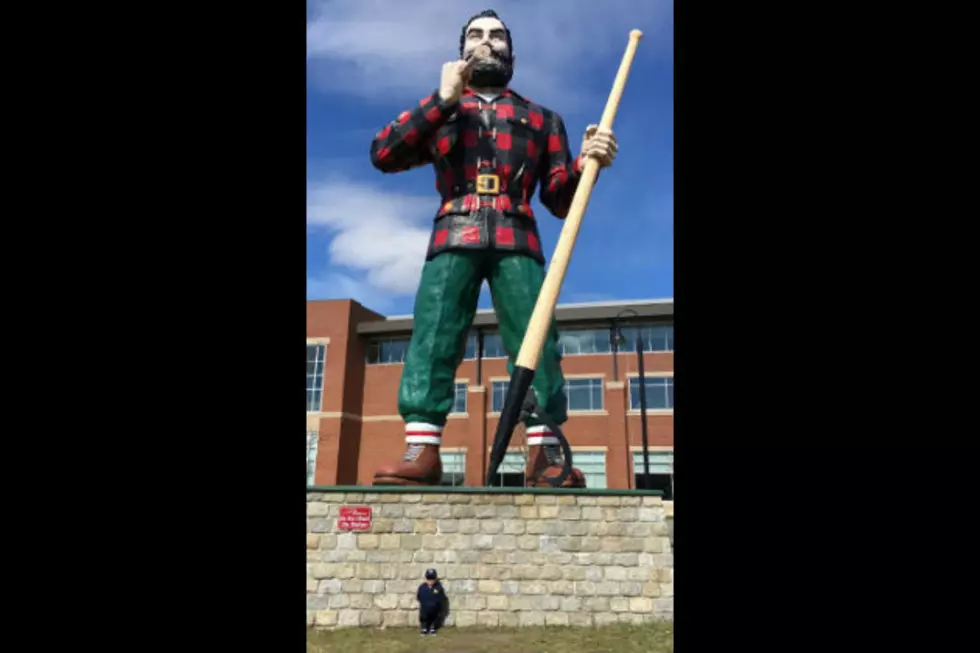 Can You Guess Who This is Standing in Front of the Paul Bunyan Statue in Bangor?