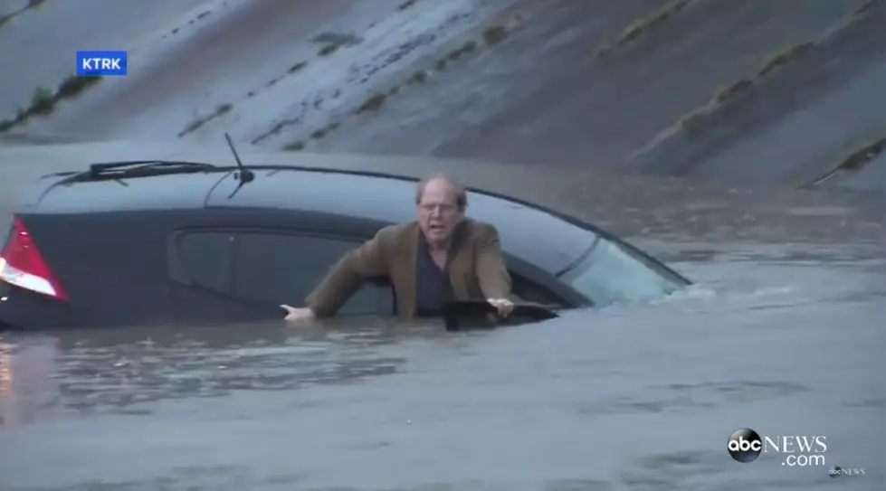 Reporter Saves Man From Sinking Car in Houston  [VIDEO]