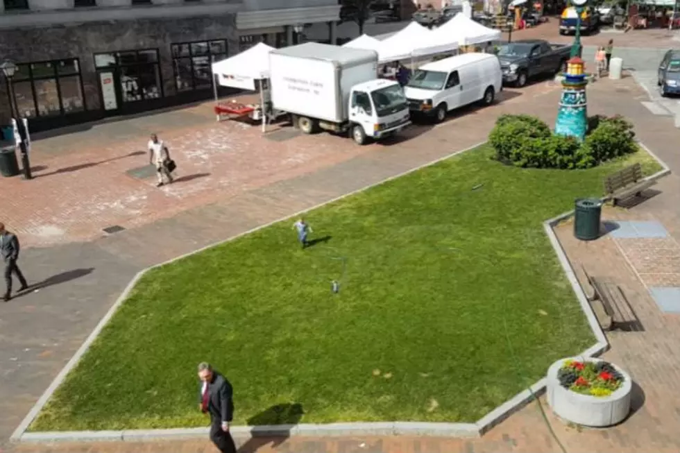 WATCH: Young Boy Has So Much Fun Playing In the Sprinkler Outside Our Studios at One City Center