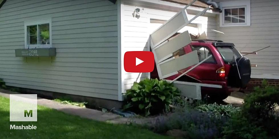 Wicked Old Guy Blasts Out of Closed Garage in SUV [VIDEO]