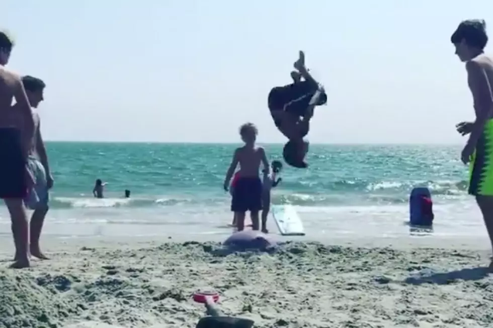 Kids Perform Stunts on the Sand at Pine Point Beach Using a Buried Yoga Ball