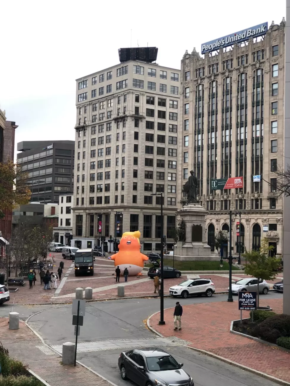 Giant Inflatable Baby Trump Appears In Monument Square