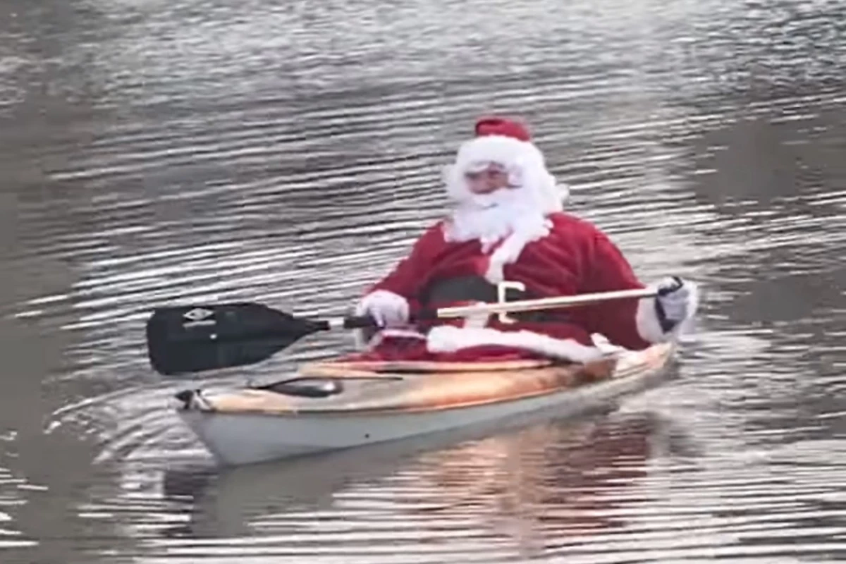 Watch Santa Kayak on Flooded Maine Baseball Field After Christmas