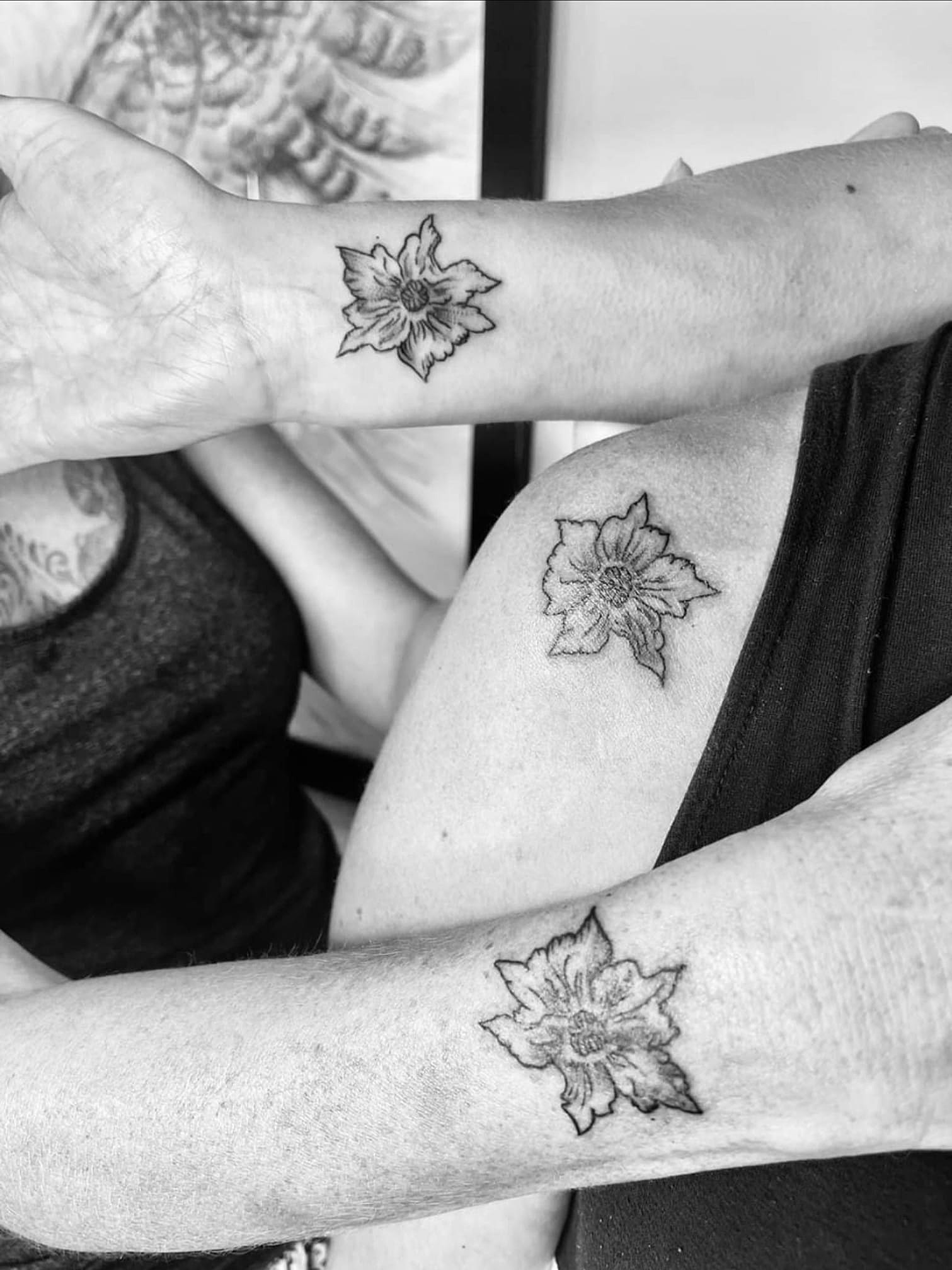 Various flower tattoos on the left arm - Tattoogrid.net