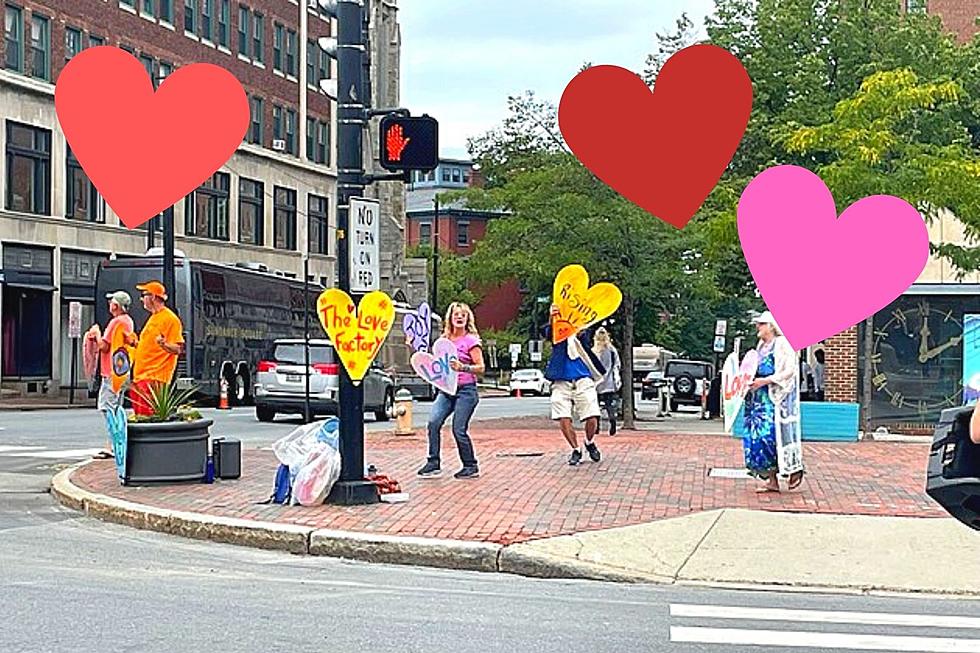 What’s With the Signs and Dancing at Congress Square in Portland? It’s All About Love