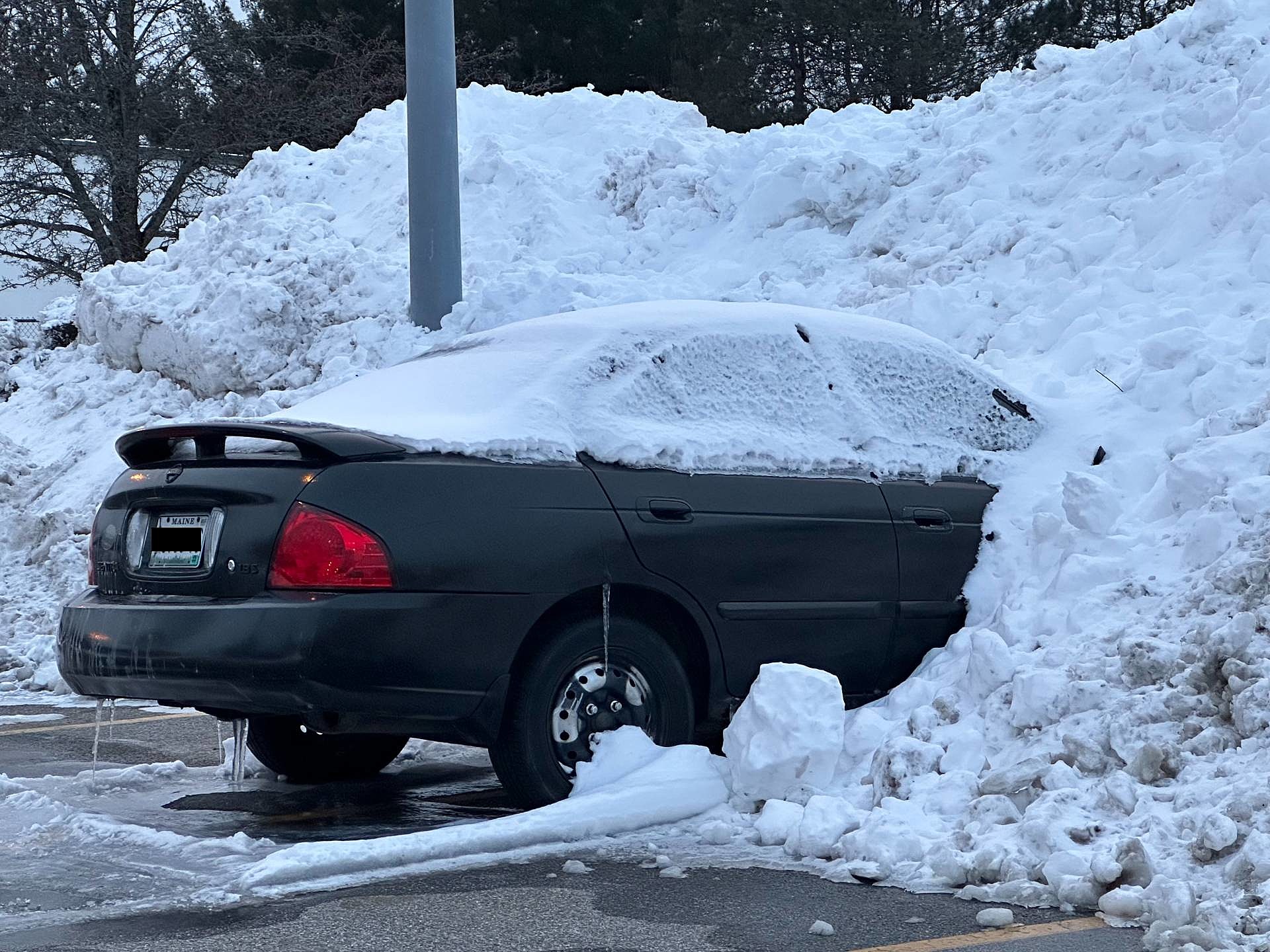 Whats the Story Behind This Car Buried in a Portland Parking
