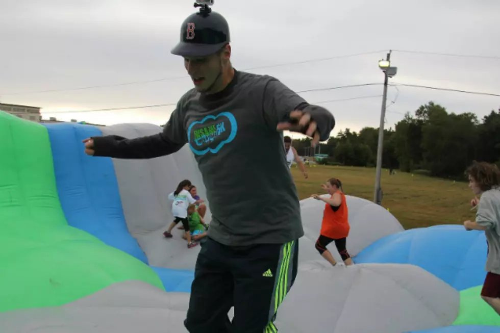 My Co-Worker Conquers Insane Inflatables [VIDEO]