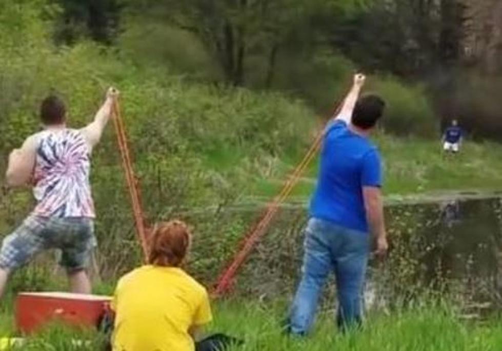 Friends Use Slingshot to Shoot Beer Across Lake [VIDEO]