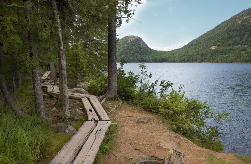 Wooden boardwalk in Jordan Pond, bubble mountains in background